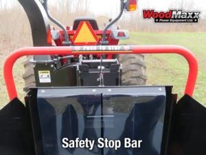 A detailed photo of an orange saftey stop bar with a shield, on an american made wood chipper by WoodMaxx